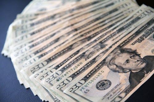 Close-up shot of multiple 20-dollar bills