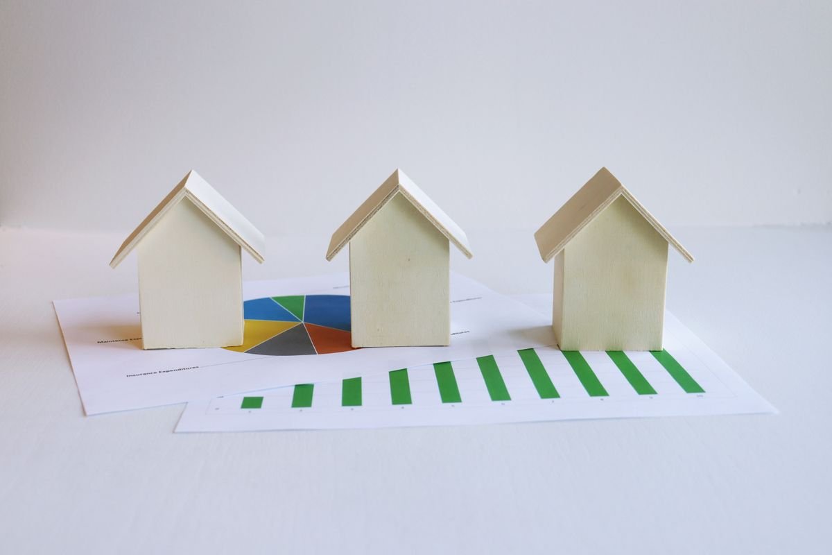 Model houses on rising financial charts