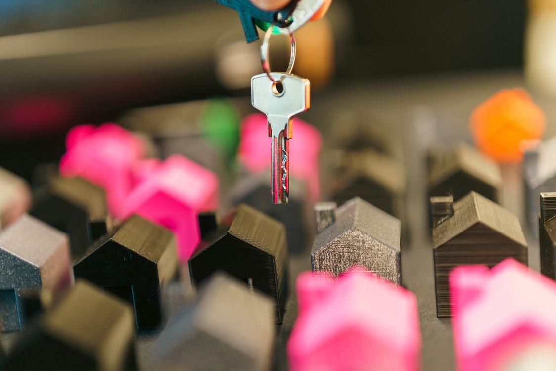 A key with the bulk of a wooden house