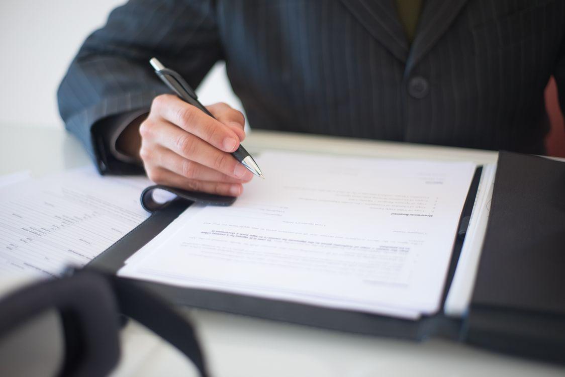 A person signing on a document